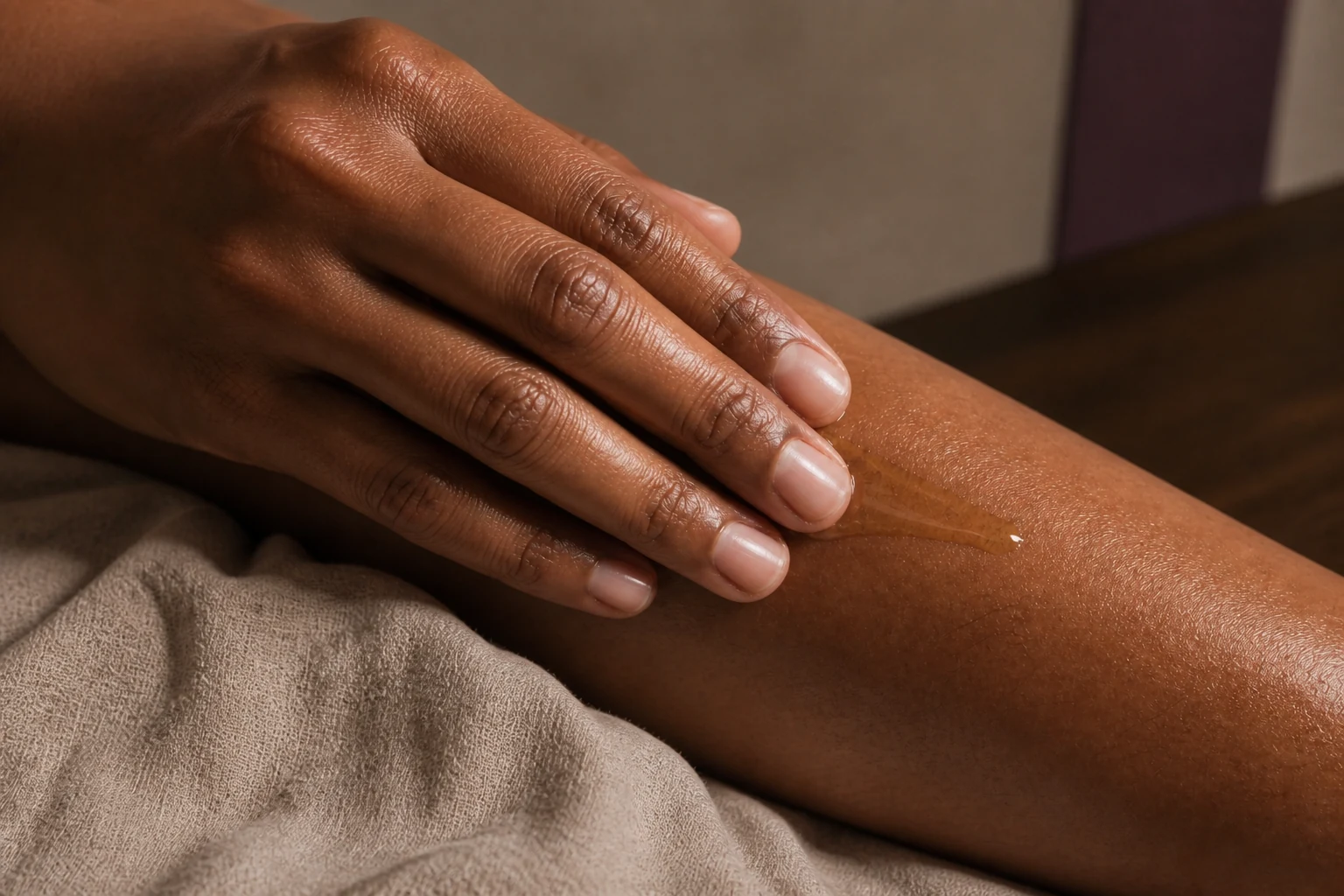 Botanical oil being smoothed over natural skin